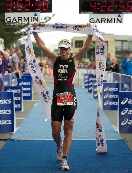 Joanna Lawns shows the signs of battle after winning the Port of Tauranga Half for a record fourth time at Mount Maunganui today